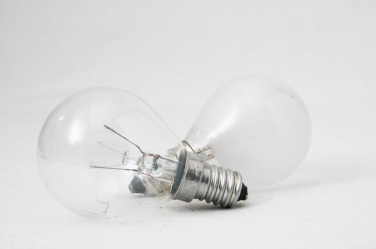 Two Different Old Incandescent Light Bulbs on a White Background