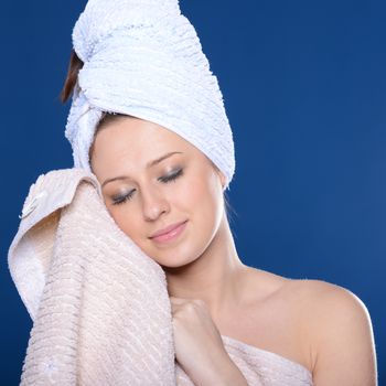 Beautiful young woman with towel