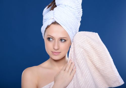 Beautiful young woman with towel
