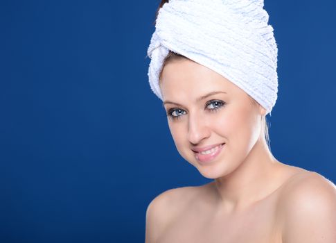 Beautiful young woman with towel
