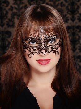 Beautiful woman in retro style over dark vintage background