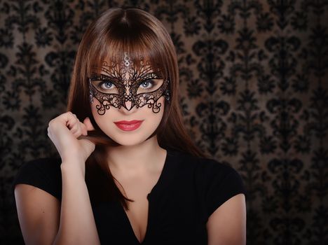 Beautiful woman in retro style over dark vintage background
