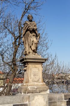 Staue on the Charles Bridge, a famous historic bridge that crosses the Vltava river in Prague, Czech Republic. 