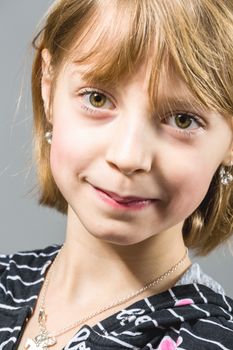 Studio portrait of young beautiful girl with nice eyes on black