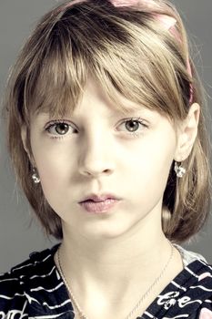Studio portrait of young beautiful girl with nice eyes on black