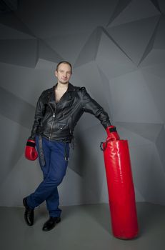 man in Boxing gloves on a grey background