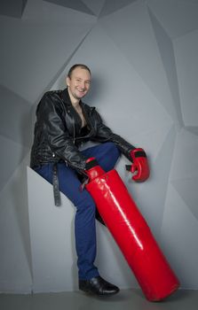 man in Boxing gloves on a grey background