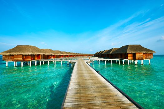 Beautiful beach with water bungalows at Maldives
