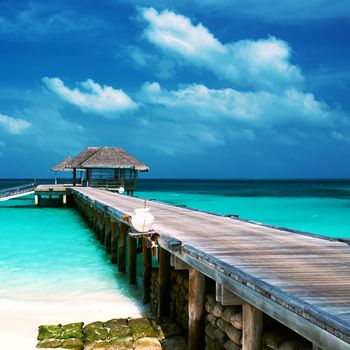 Beautiful beach with water bungalows at Maldives