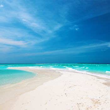 Beautiful island beach with sandspit at Maldives