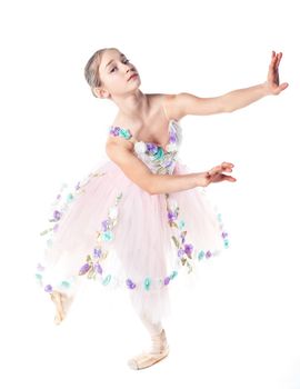 Beautiful young ballerina on a white background