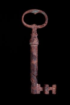 18th century antique key isolated on black