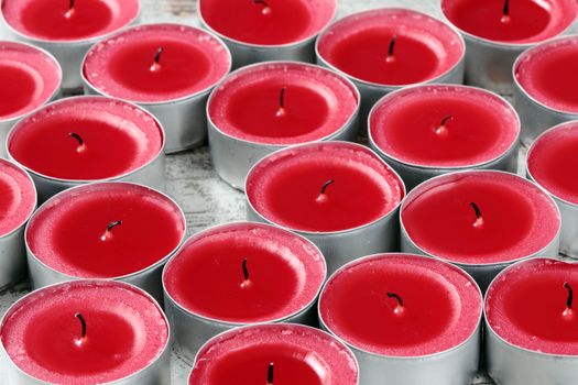 red candles on a wooden floor