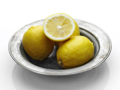 lemons in the old steel plate over white