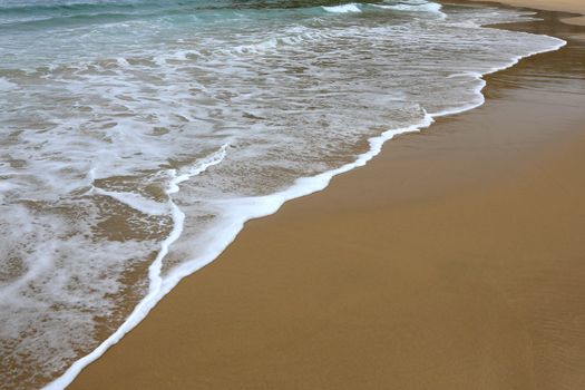 Sea and golden sand at the beautiful coast in South Africa