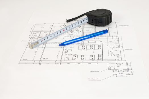 Construction drawing, tape measure and pen. Desk builder