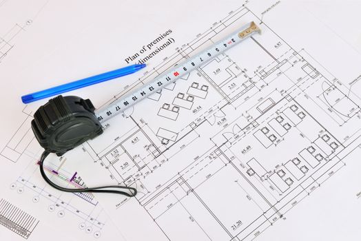 Construction drawing, tape measure and pen. Desk builder