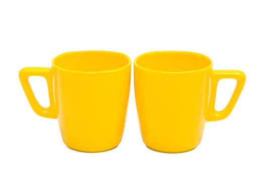 two yellow mug on a white background