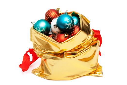 gold bag with Christmas balls on white background