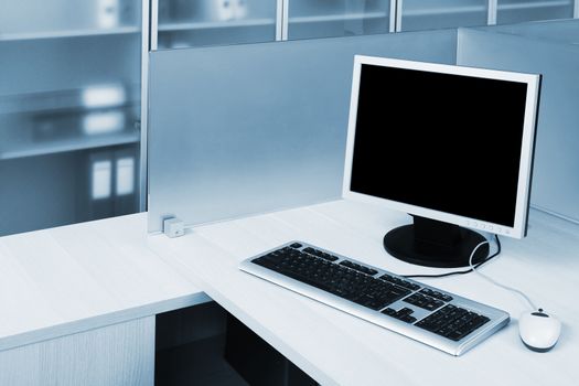 computer behind the glass in a modern office