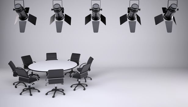 Round table and eight office chairs on a gray background. On the ceiling of the studio lighting lamps. Cooperation concept