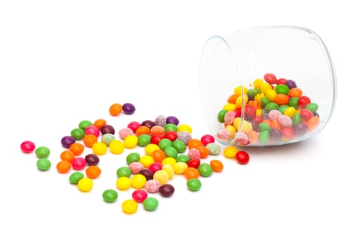 Candy in a glass jar on white background