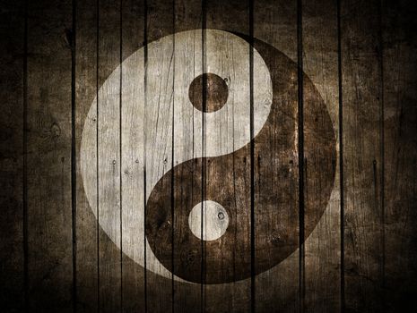 The Ying Yang sign painted on wooden wall