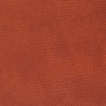 Old red leather background, strict close up