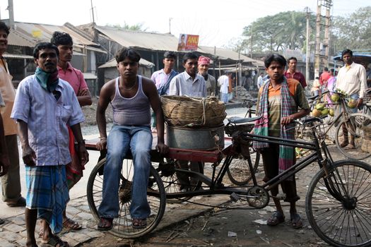 People on market in Kumrokhali, West Bengal, India, January 12, 2009. The people usually suspend all their routine work on the market day and attend the market, many with their family members and friends. These markets become the central points for socio-cultural activities.