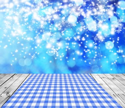 Empty wooden deck table with winter bokeh background. Ready for product display montage. 