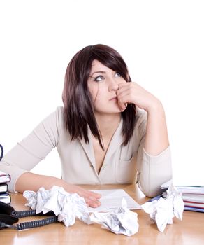 Stressed business woman with stack of paperwork, pile of crumpled papers isolated