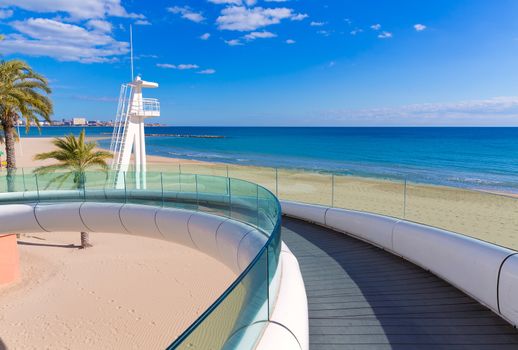 Alicante el Postiguet beach playa with modern pedestrian white bridge at Spain