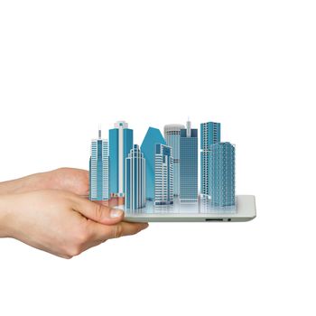 Hands holding a tablet computer. In screen tablet city of skyscrapers