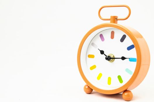 Orange Alarm Clock on a White Background