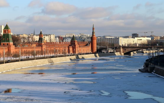 Moscow Kremlin in winter photographed on a background of the Moskva River covered with ice