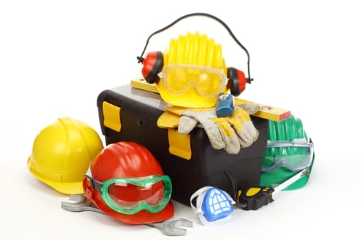 Some color protective helmets  and toolbox on white