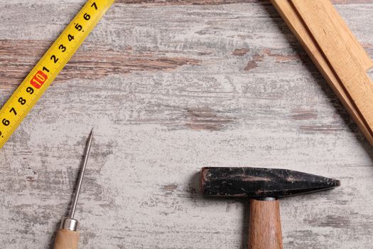 Some carpentry tools on a wooden table