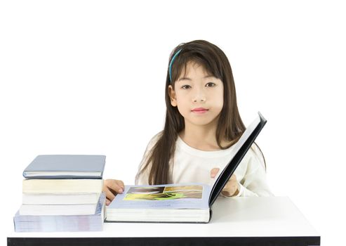 The young student reading the book on a white background