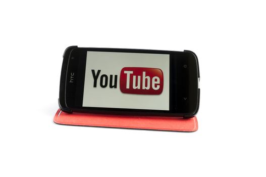 Bucharest, Romania - Jan 24, 2014: Photo of YouTube on smartphone screen. YouTube is a video-sharing website, created by three former PayPal employees in February 2005 and owned by Google since late 2006, on which users can upload, view and share videos, Jan 24, 2014 in Bucharest, Romania
