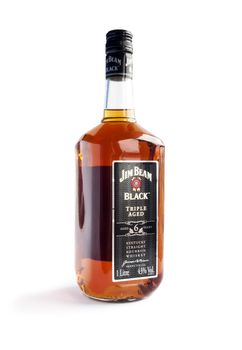 Bucharest, Romania - Jan 24, 2014: A bottle of Jim Beam Black isolated on white background. Jim Beam is an American brand of bourbon whiskey produced in Clermont, Kentucky. It was one of the best selling brands of bourbon in the world in 2008.