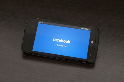 Bucharest, Romania - January 28, 2014: Photo of a HTC Desire device, showing the Logging out from the Facebook app for Android devices.