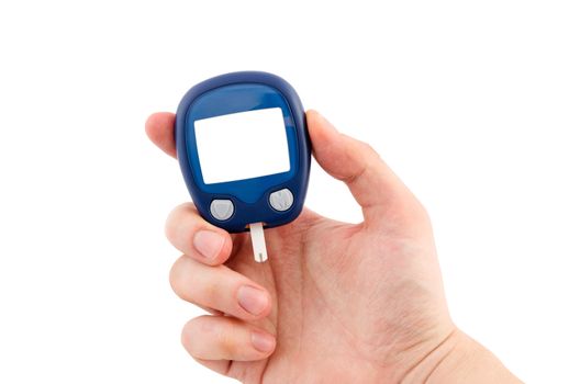 Hand holding glucometer with blank display isolated on white background