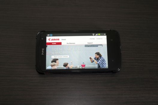 Bucharest, Romania - February 05, 2014: Photo of a HTC Desire device, showing the Canon web page.Canon Inc. is a Japanese multinational corporation specialized in the manufacture of imaging and optical products.