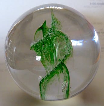 Green pattern within a bright glass globe