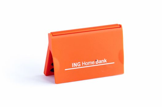 BUCHAREST, ROMANIA - FEB 17,2014: ING Home Bank token isolated on white. The ING Group is a Dutch multinational banking and financial services corporation headquartered in Amsterdam. 