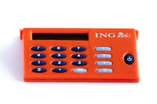 BUCHAREST, ROMANIA - FEB 17,2014: ING Home Bank token isolated on white. The ING Group is a Dutch multinational banking and financial services corporation headquartered in Amsterdam.