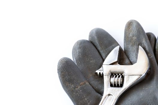 Tools and glove  over a white background with space for text