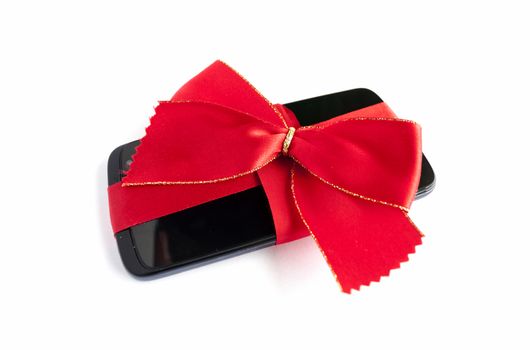 Smart Phone with Red Ribbon and Bow isolated on white background