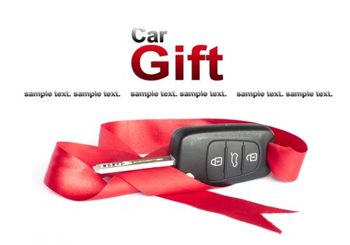 Gift key concept with red Bow on a white background.