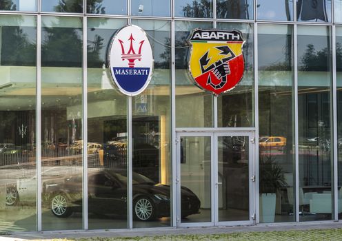 Bucharest-June 21. Signage on Abarth and Maserati shop. Many luxury car companies have opened in Romania because the force of buying has increased in the last 10 years.Bucharest, Romania, June 21, 2013.